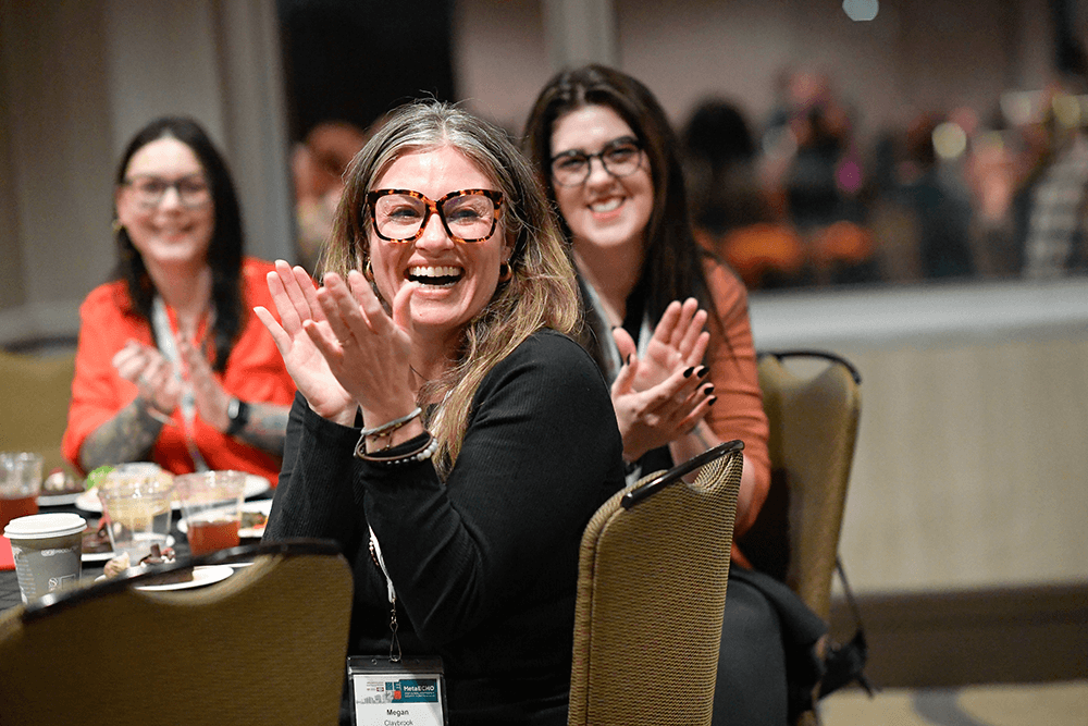 Meta Echo image of echo employees smiling and attending the event.