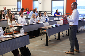 Physician Assistant orientation leader speaks to group of incoming students