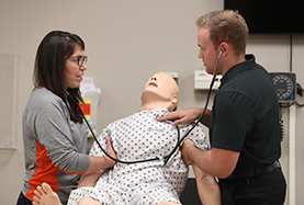 Athletic Training Students Practicing on Dummies