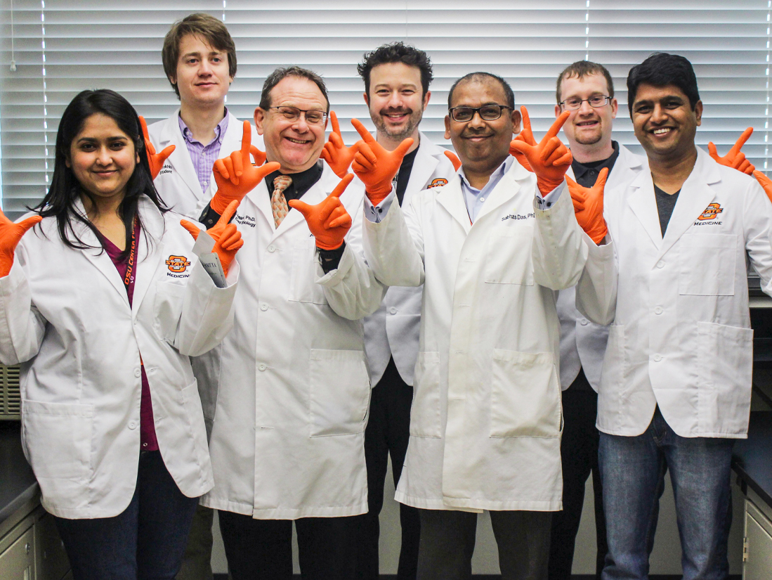 Students wearing orange gloves, hand signalling go pokes