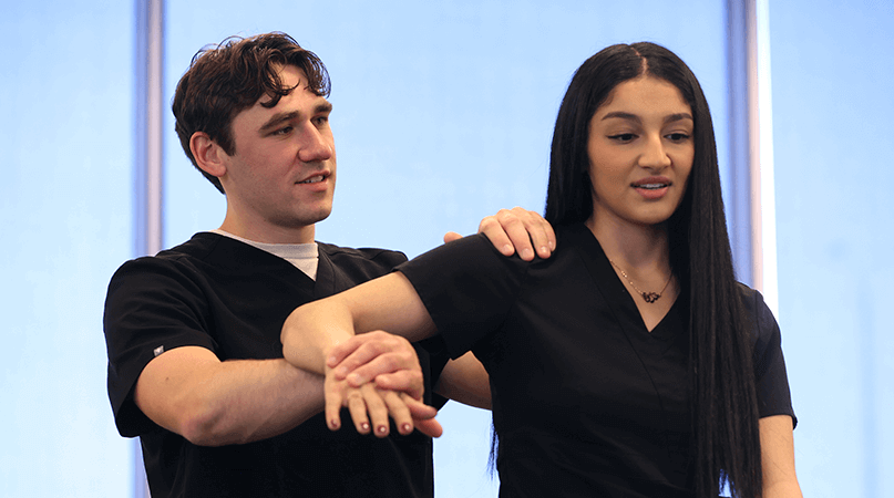 Academics - Medical students practice osteopathic manipulative medicine techniques (OMM) on the OSU Center for Health Sciences campus in Tulsa, Okla
