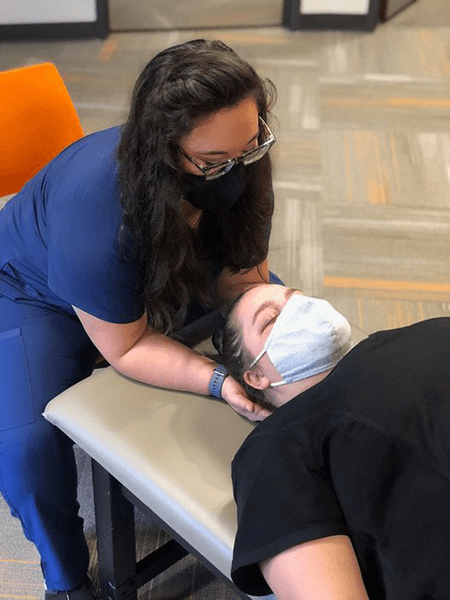 First-year medical student, Becca, practices her OMM skills.
