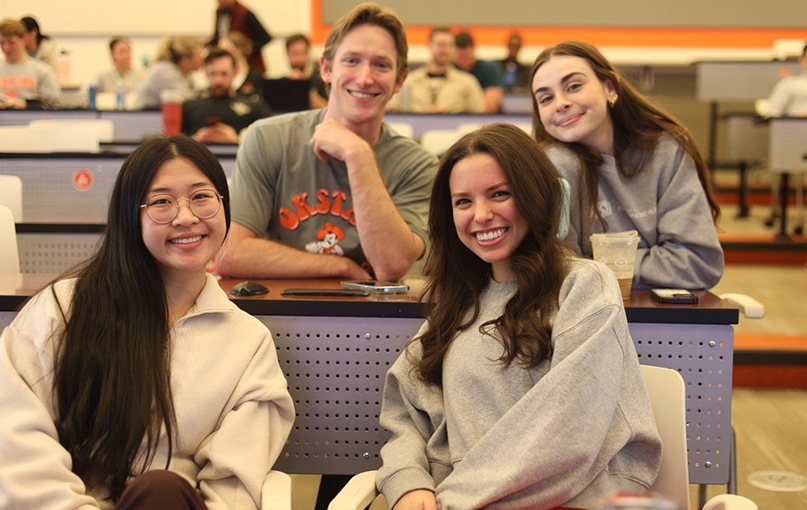 Prospective medical students pose for a photo at a recruitment event.