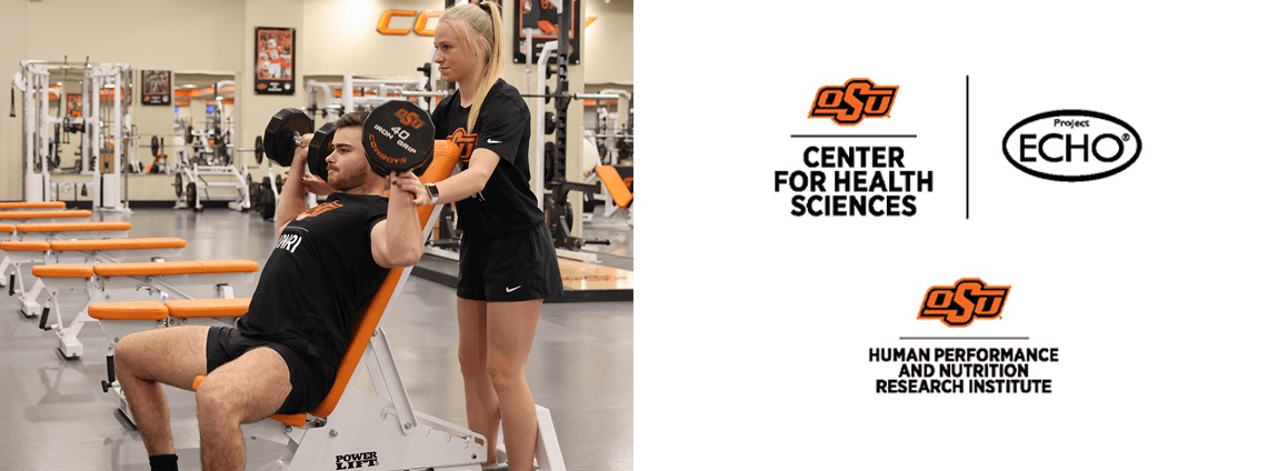 Trainer and weightlifer practice strength training at the OSU Center for Health Sciences gym.